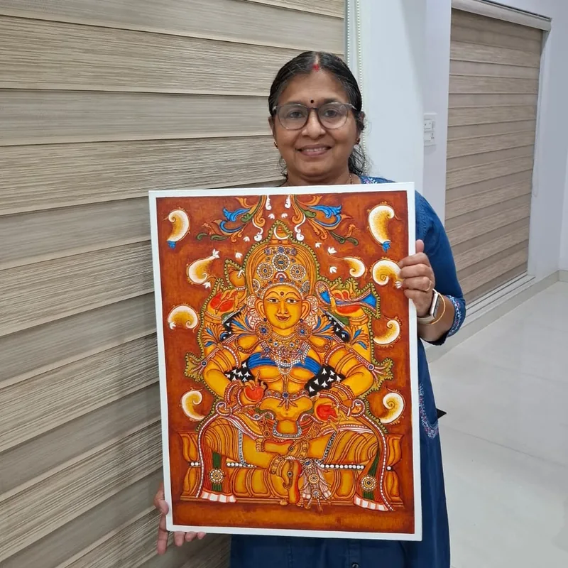 Sreelatha C.R holding her Kerala mural Bhuvaneshwari painting