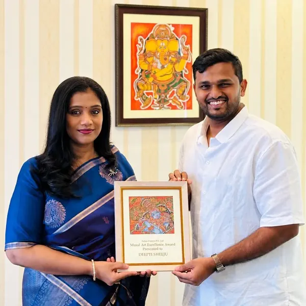 Deepti receiving her mural course certificate